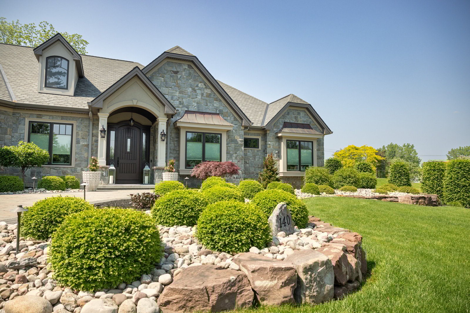 planting bed gravel shrubs boulder home entry front