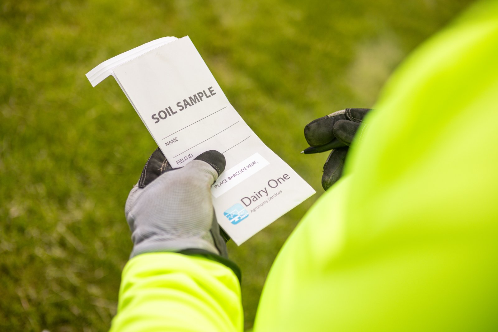 lawn care tech filling out a service sheet