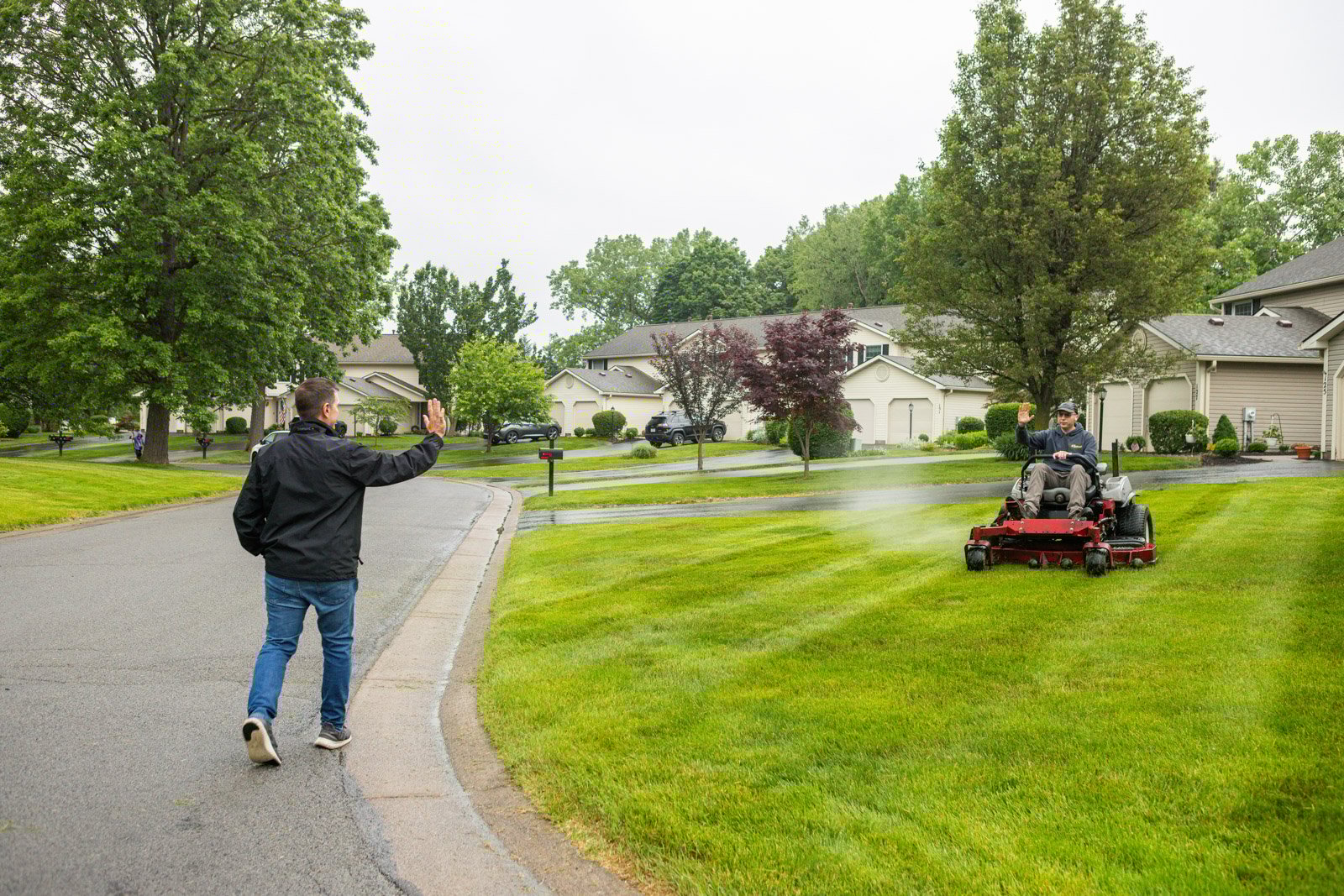 homeowner waving to professional