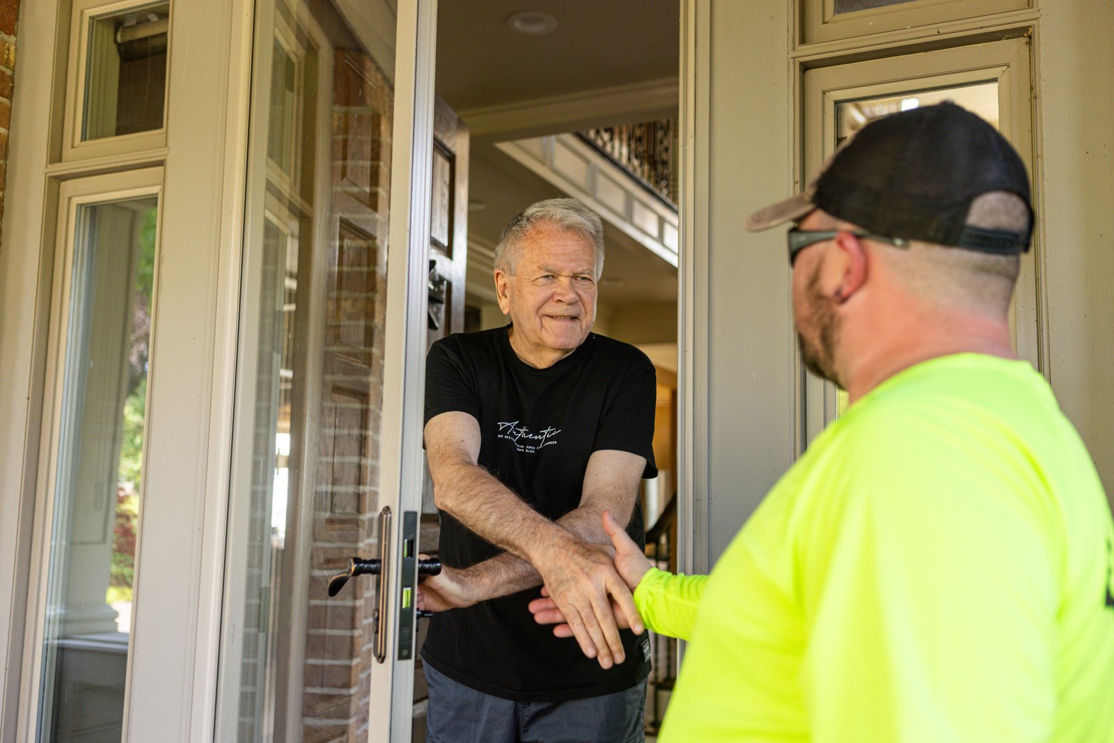 customer meeting a trimline lawn care tech