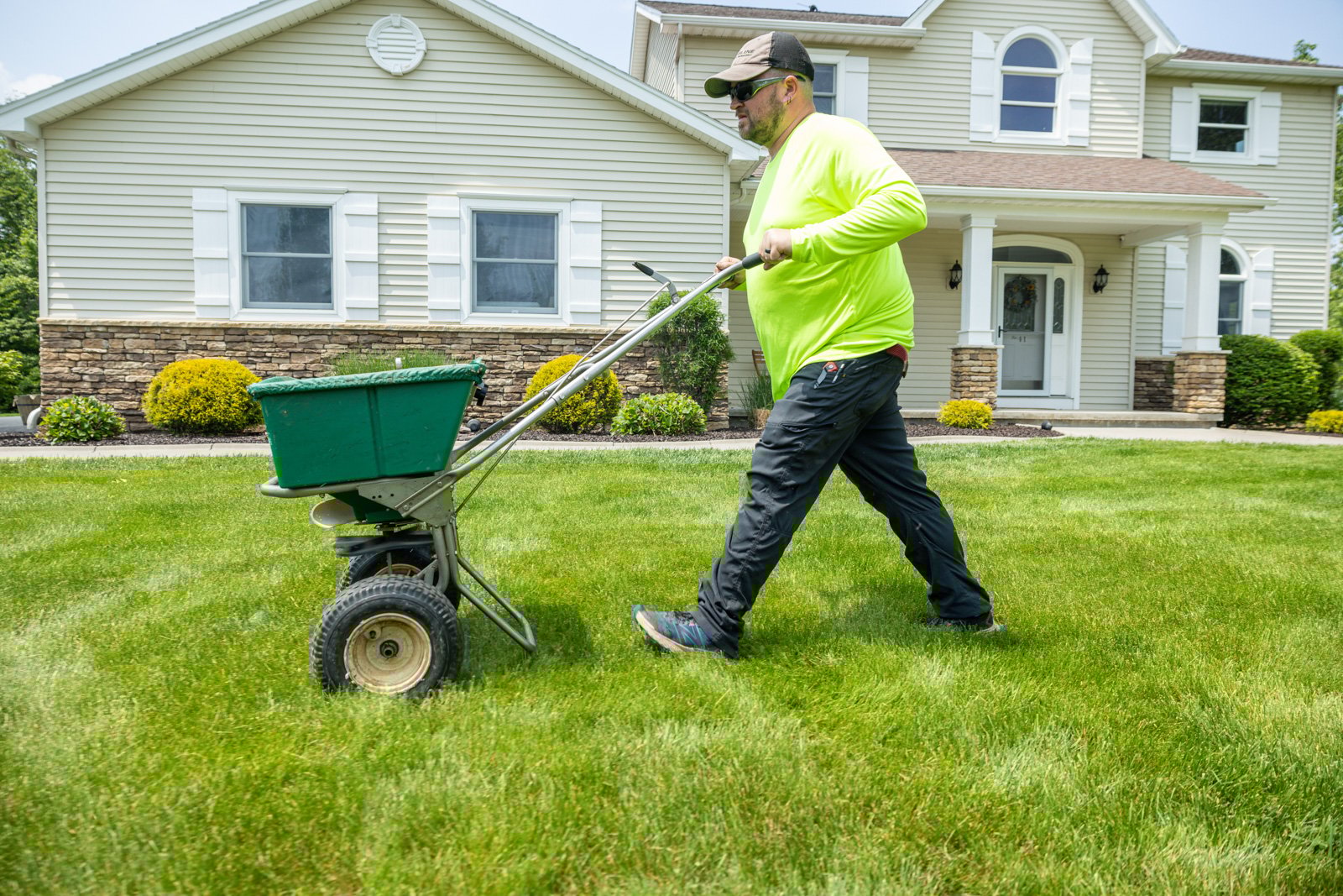 overseeding a lawn with a manual spreader in the fall