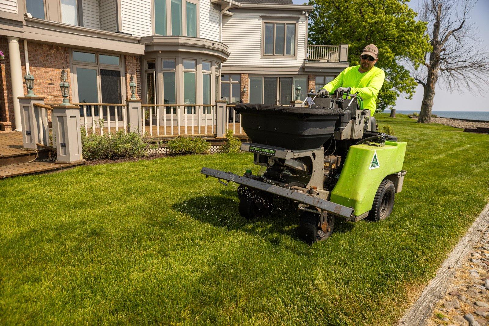 lawn care tech using commercial grade equipment for lawn care applications