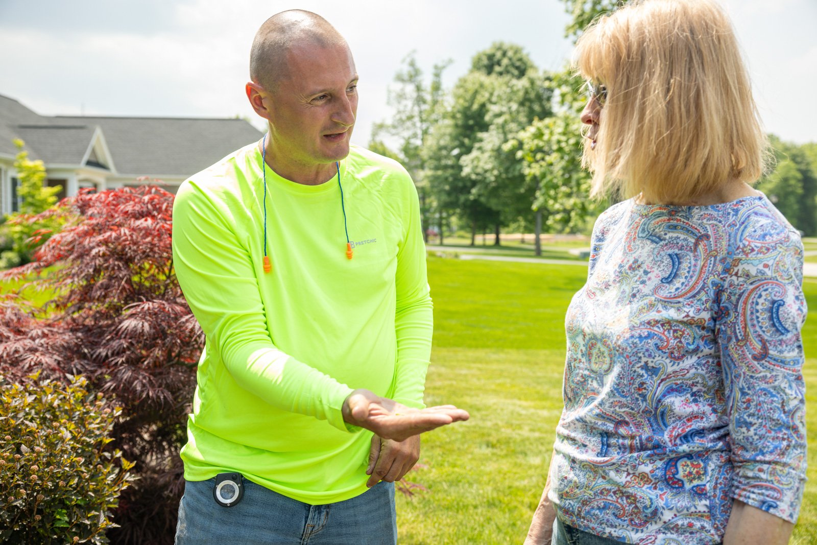 plant health care tech showing homeowner signs of box tree moths