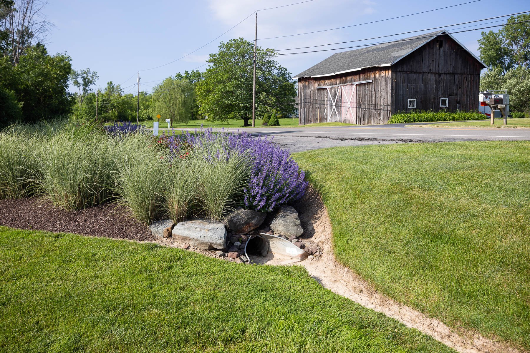 most water should drain into the grass rather than run off into drainage ditches